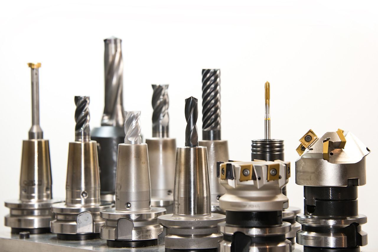Close-up of a drill and metal hand tools used for HVAC service